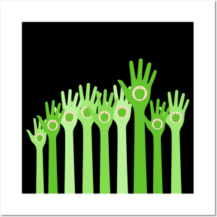 Raised green hands with apple inside Posters and Art